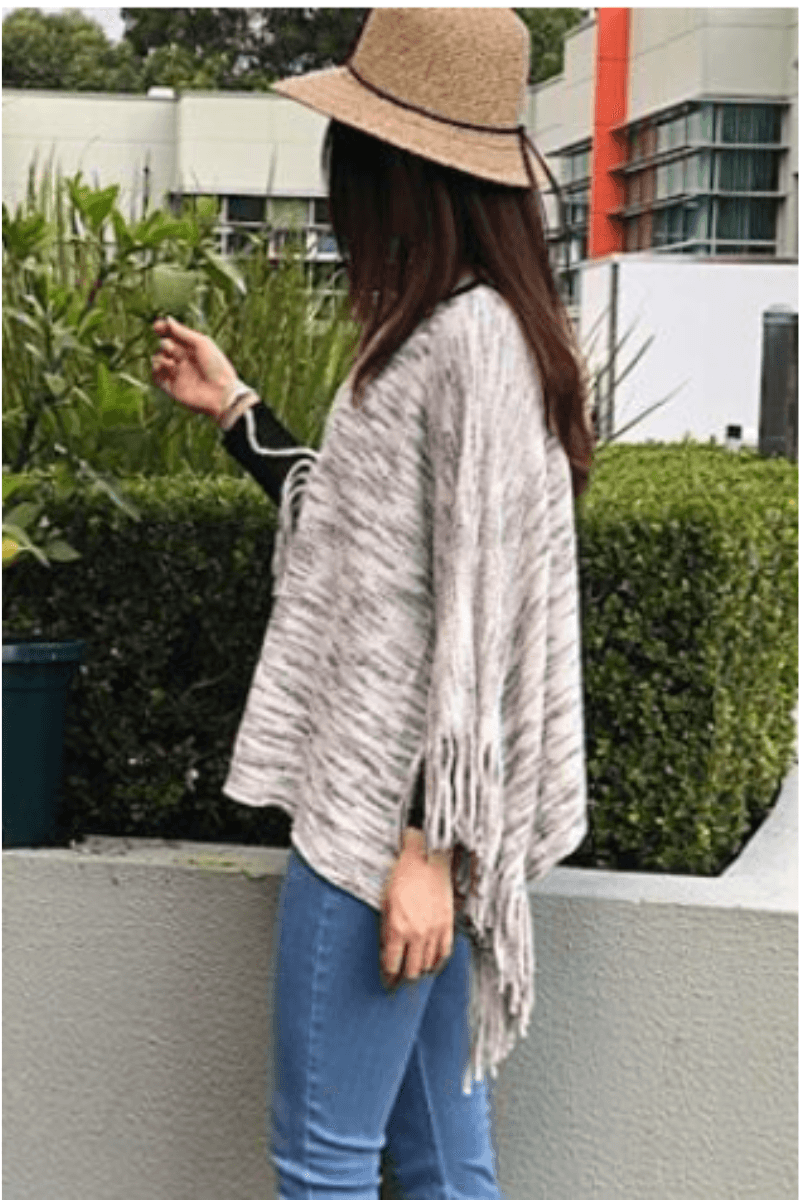 Short Natural Ponch with Fringe Detail.