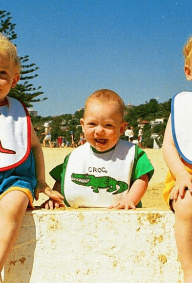 Ozi Varmints Baby Bib - White/Ocean - Flip.