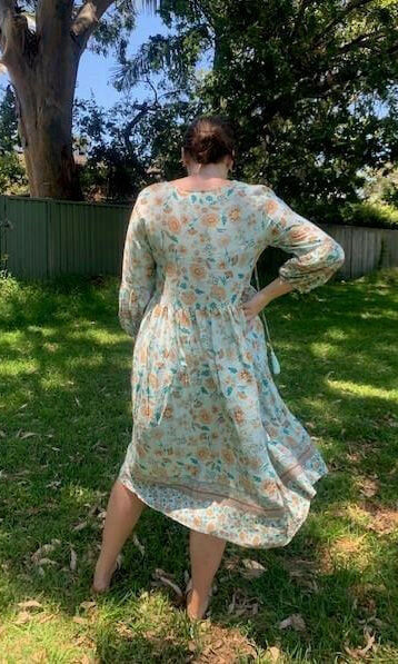 D8640BAQ Silver Wishes Aqua Floral Long- Sleeved Dress.