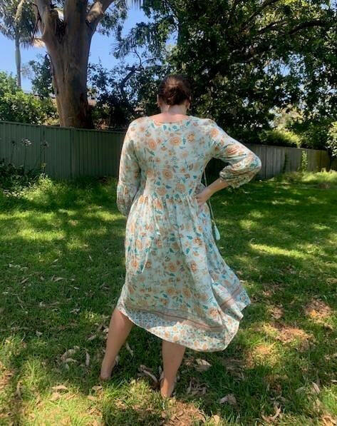 D8640BAQ Silver Wishes Aqua Floral Long- Sleeved Dress.