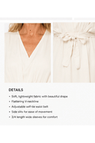 White dress with details on fabric, neckline, waist belt, side slits, and sleeves.