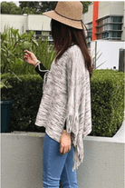 Short Natural Ponch with Fringe Detail.